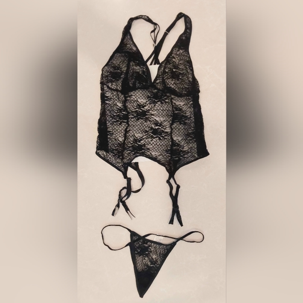 Black stretch lace cami with garters and g-string. Size large